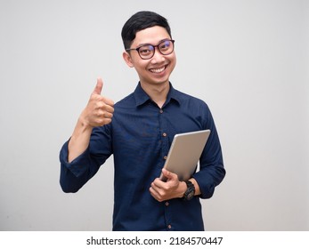 Young businessman hold tablet gentle smile show thumb up isolated