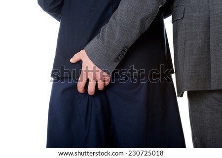 Young businessman holding hand on his beautiful partners ass