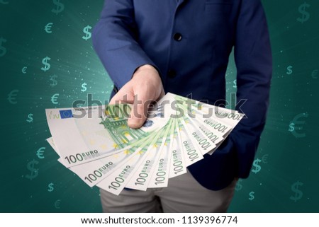 Millionaire business woman holding dollar bills - isolated over white
