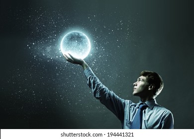 Young Businessman Holding Moon Planet In Hand