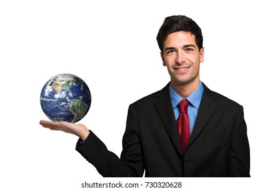 Young businessman holding the planet in his hand
