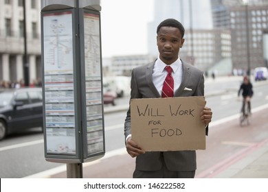 Young Businessman Holding 