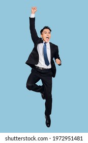 young  businessman jumping in air