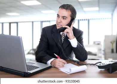 Young Businessman Latino In Office