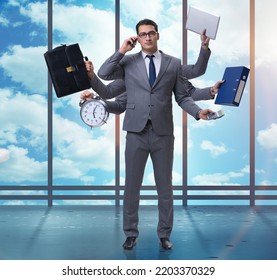 Young Businessman In Multitasking Concept