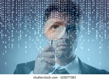 Young businessman observing a binary code on a screen through a magnifying glass