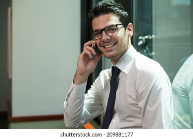 Young Businessman On The Phone - Shutterstock ID 209881177