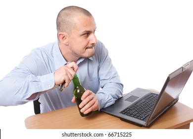 Young Businessman Opening A Bottle Of Beer In The Office - Illegal Alcohol Drinking At Work