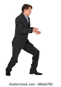 Young businessman pushing something with his hands on a white background