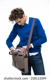 Young Businessman Searching Documents In His Bag