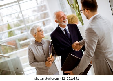 Young Businessman Senior Clients Standing Modern Stock Photo 1242516151 