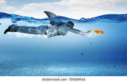 Young Businessman With Shark Flipper Swiming Under Water