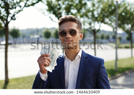 The young businessman shows off his profit
