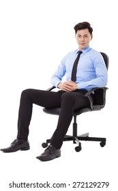 Young Businessman Sitting In A Chair Isolated