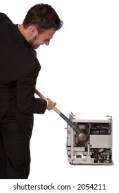 Young Businessman Smashing A Computer With A Sledge Hammer