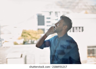 Young Businessman, Smiling And Using Mobile Phone To Make Call Outside Office. Candid Person Holding Conversation Online. Smart, Casual, And Working Man Standing While Talking With Tech In The City.