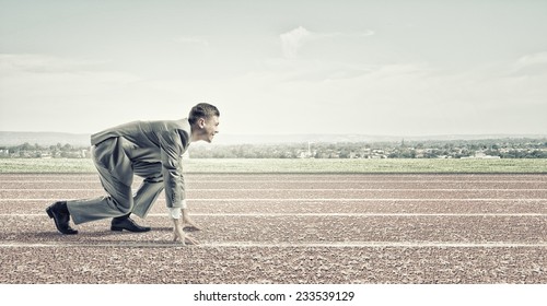 young-businessman-standing-start-pose-ready-stock-photo-233539129