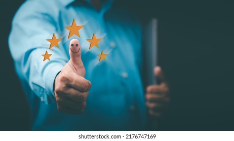 Young Businessman Stretching And Thumbs Up, Satisfaction Survey Concept.writing Online Review With 5 Five Star Rating, Customer Services Best Excellent Business Rating Experience. 