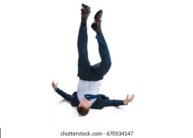 young businessman in suit falling upside down isolated on white