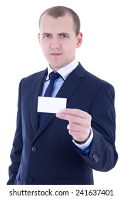 young businessman in suit holding business card isolated on white background