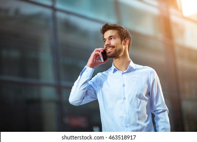 Young Businessman Talking On His Phone Outdoors