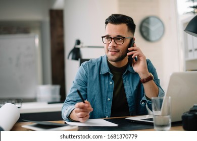 Young businessman talking on phone. Handsome man using his smartphone.  - Powered by Shutterstock