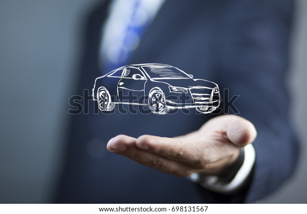 young businessman touching car in screen on\
dark background