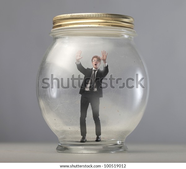 Download Young Businessman Trapped Glass Jar Stock Photo Edit Now 100519012 Yellowimages Mockups