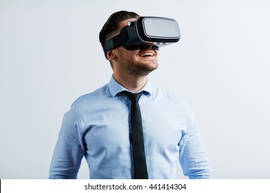 Young businessman trying vr goggles - Powered by Shutterstock