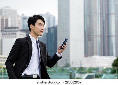 Young businessman use of cellphone