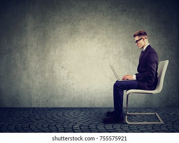 Young businessman using his laptop computer