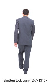 Young Businessman Walking Away From Camera On White Background