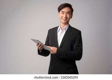 A Young Businessman Wearing  Suit Over White Background Studio