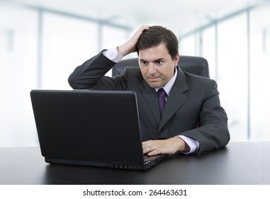 young businessman working with is laptop at the office - Shutterstock ID 264463631