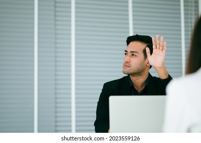 Young Businessmen Raises His Hand To Raise Questions About The Meeting Content With The Presenter In The Workshop. Brainstorming And Teamwork Concept.