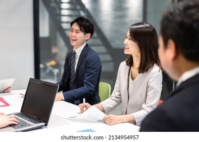Young Businessperson Facilitating A Meeting