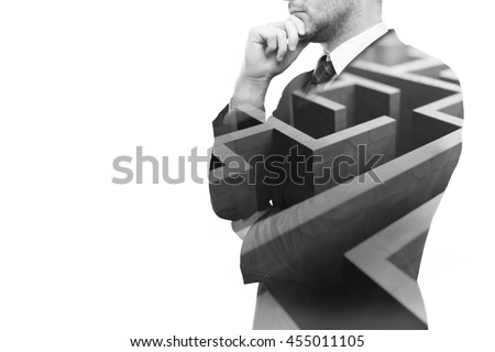 Young businessperson thinking about ways to overcome business obstacle. Isolated on white background with maze and copy space. Double exposure