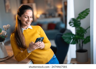 Young businesswoman in business casual clothes browsing social media on smart phone. - Powered by Shutterstock