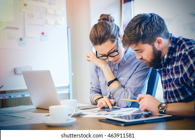 Young Businesswoman And Businessman Working Together In Office