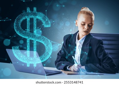 Young businesswoman at desk writing, laptop beside, holographic dollar sign overlay, dark background, concept of digital finance and technology - Powered by Shutterstock