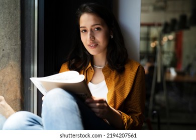 Young businesswoman drinking coffee in her office. Woman enjoy in coffee break	 - Shutterstock ID 2194207561
