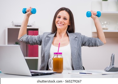 Young Businesswoman Is Getting Ready For Work In Her Office.