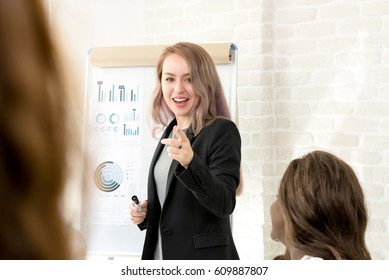 Young Businesswoman Making A Presentation In The Meeting - Female Leader Concept