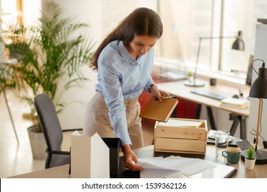 Young Businesswoman Organizing Documents In The Office