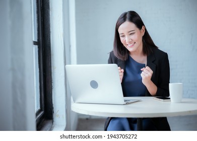 Young Businesswoman Rejoicing After Sales Surpass Their Target Check Results From Laptop