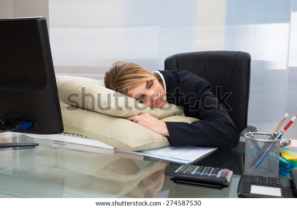 Young Businesswoman Sleeping On Pillow Desk Stock Photo Edit Now