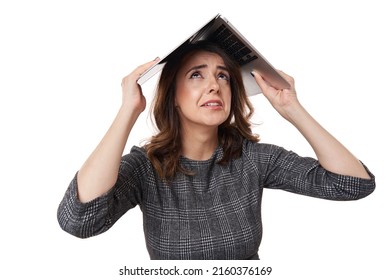 Young businesswoman symbolically sheltering herself under her laptop used as roof, while looking up