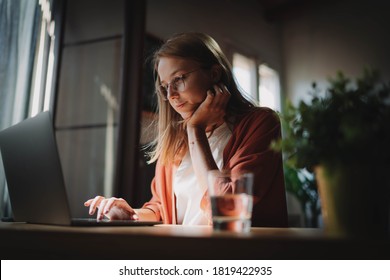 Young Businesswoman Thinking About Something While Sitting Front Open Laptop Computer Reading Email From Client, Long Hours Of Work Concept, Female Manager Working At Modern Loft Coworking Space