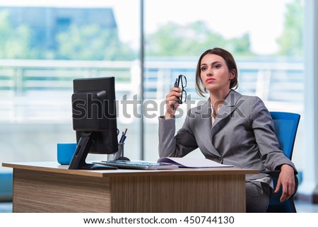 Young businesswoman tired after long working day