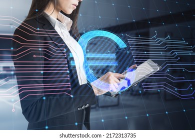 Young businesswoman using tablet with glowing euro hologram and lines on blurry office interior background. E-commerce, online banking, cryptocurrency and finance concept. Double exposure